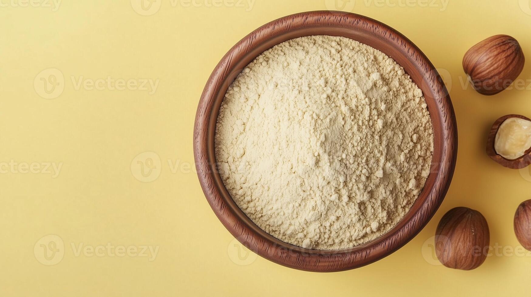 Chesnut flour on brown wooden bowl and some nuts for baking, gluten free copy space photo