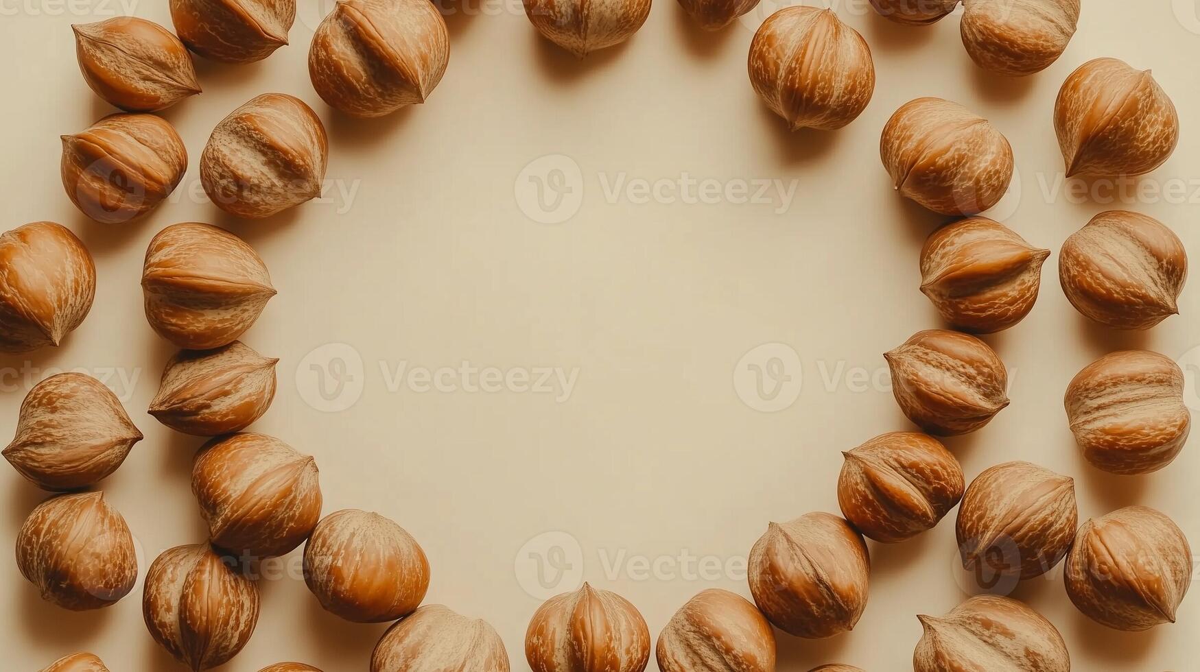 Circular arrangement of chestnuts natural agriculture, copy space solid pink background photo