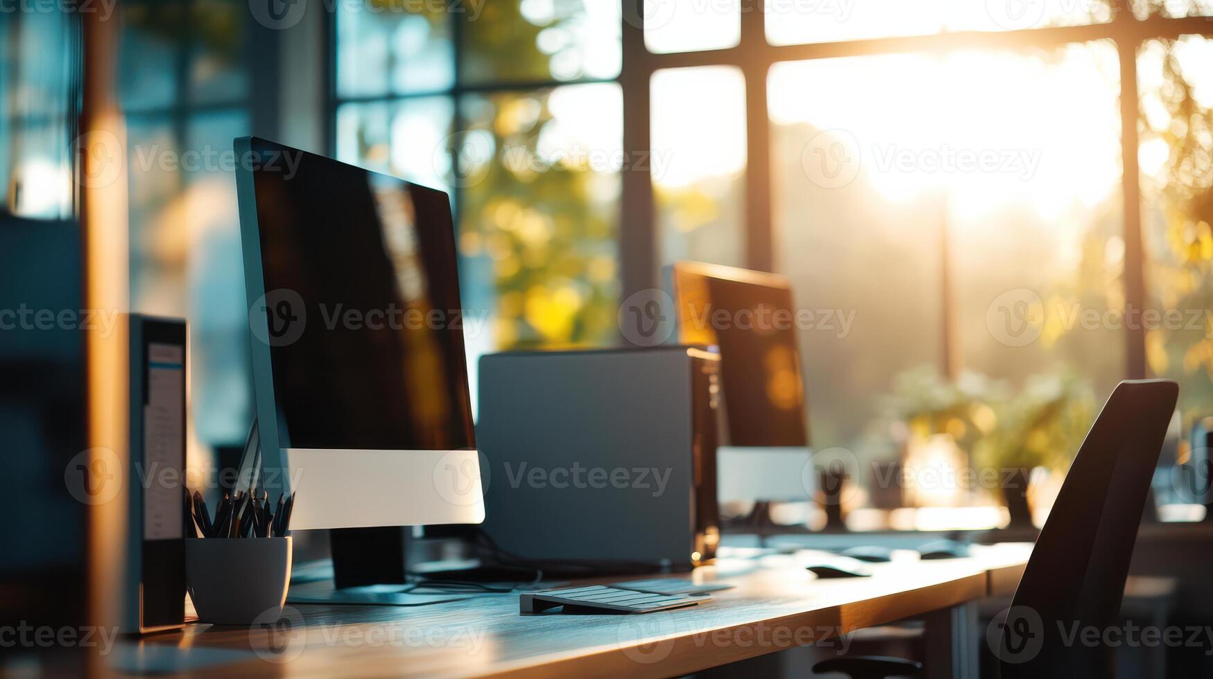 A computer monitor is sitting on a desk in front of a window photo