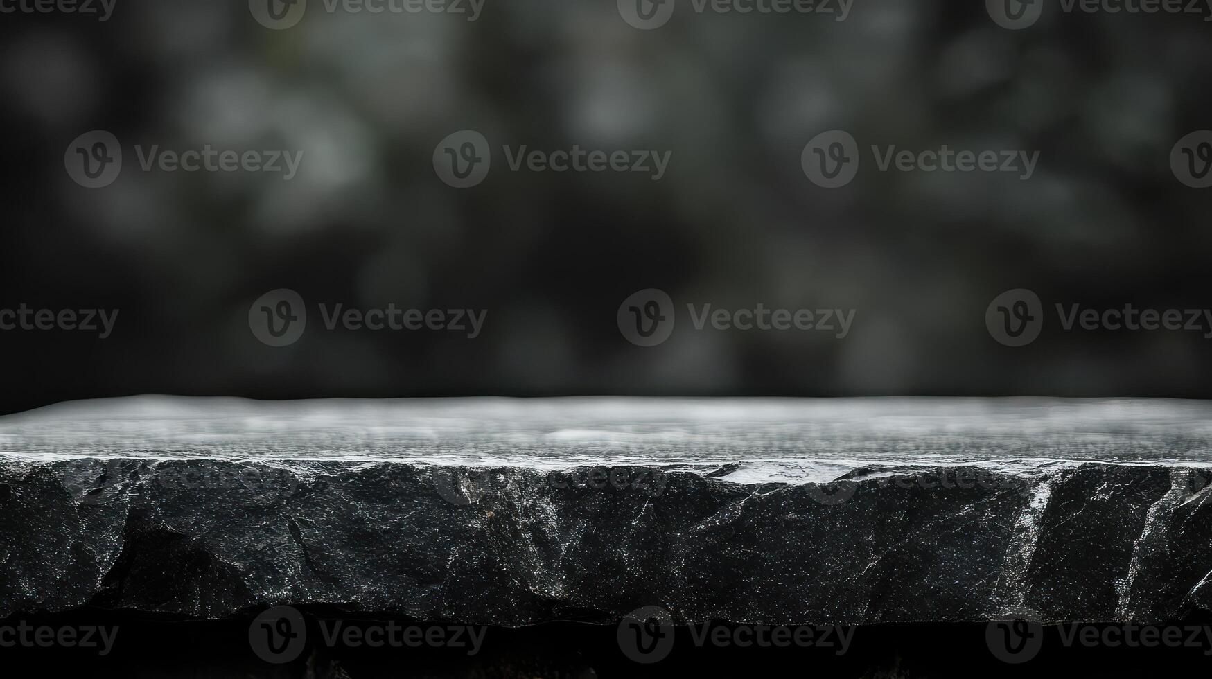 A black stone slab on a table with a blurred background photo