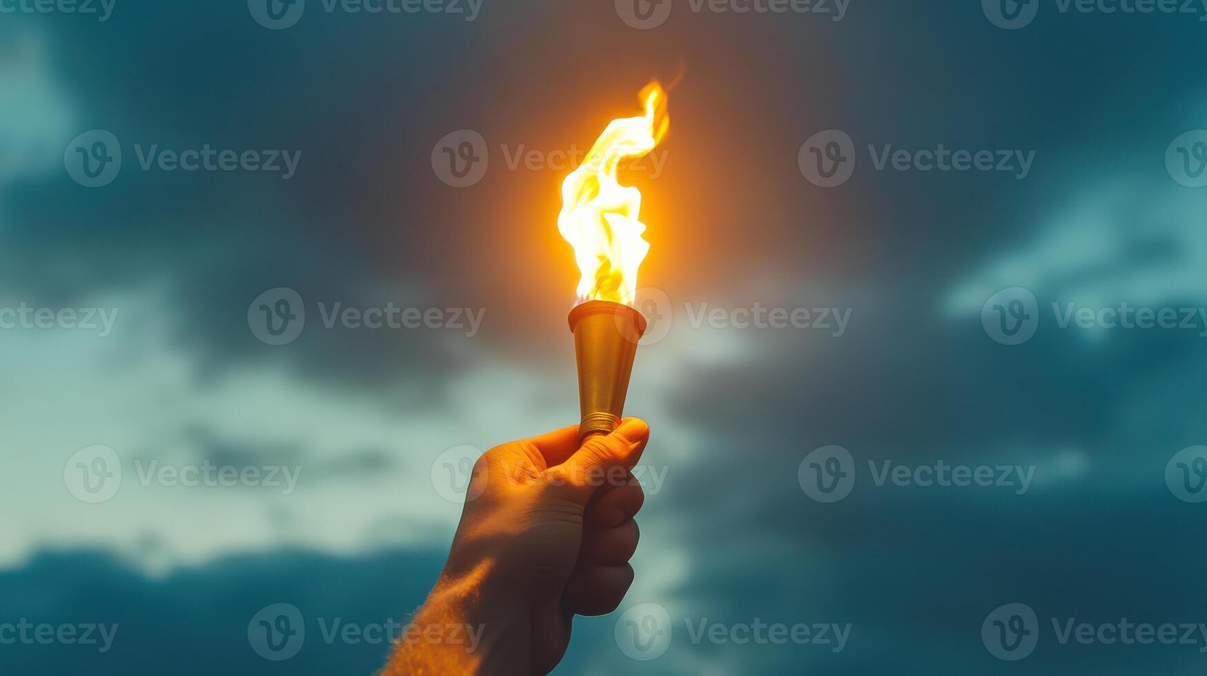 A person holding a torch with a flame in their hand photo