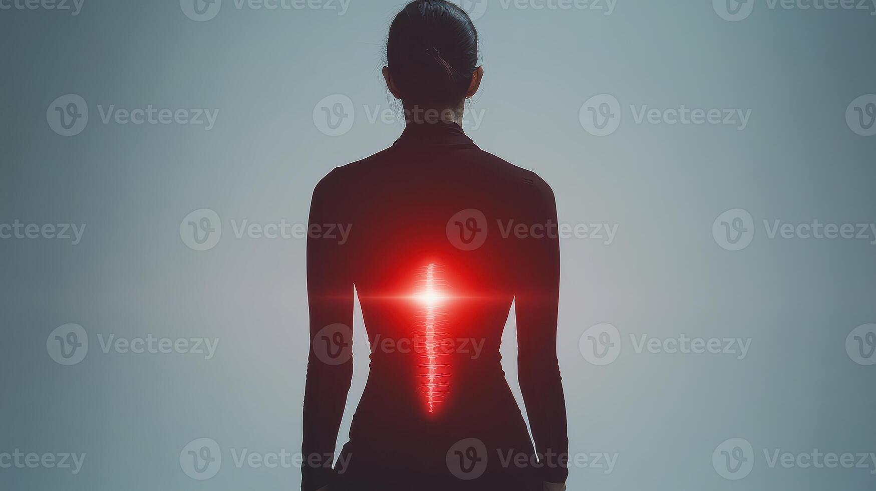 A woman with a back pain is shown with a red light photo
