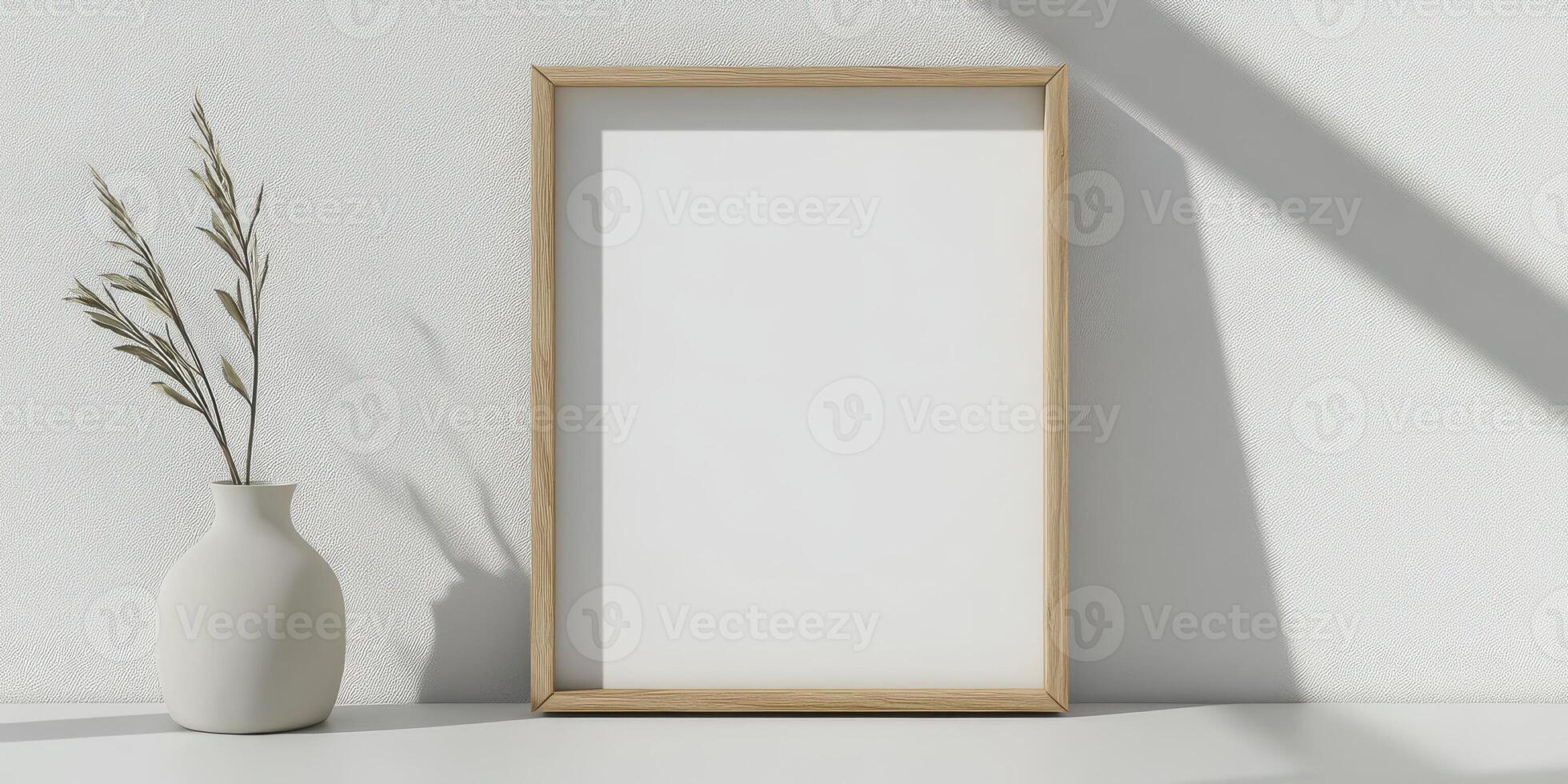 A blank frame sitting on a table next to a vase photo