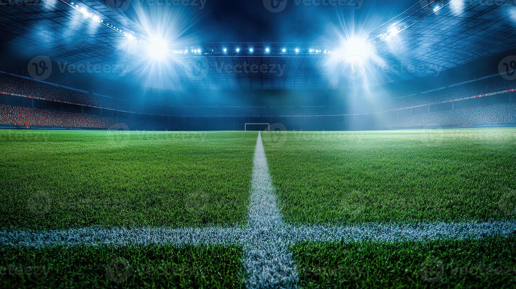 An empty soccer field with lights shining on it photo