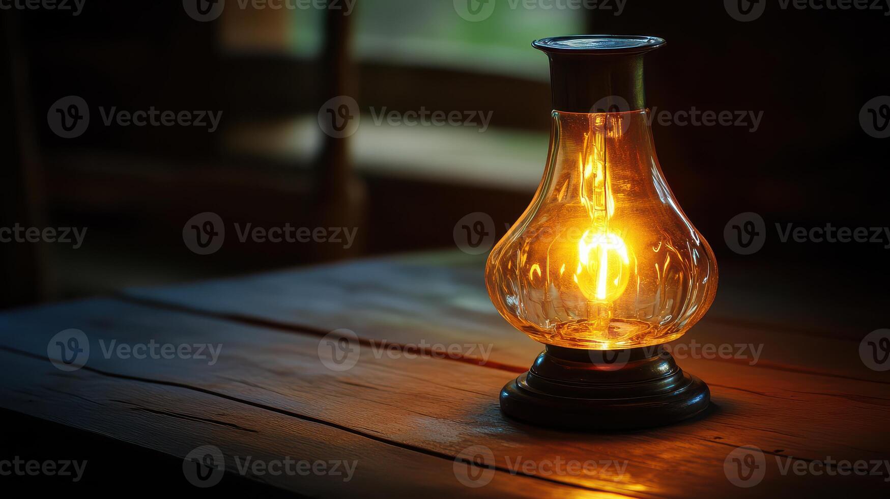 An old fashioned lamp on a wooden table photo