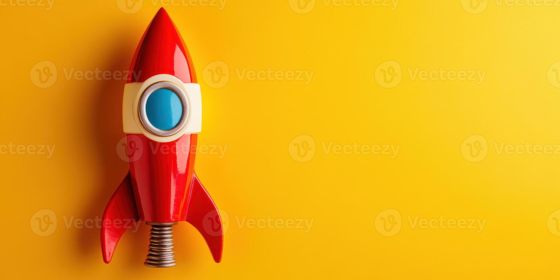 A red rocket ship on a yellow background photo