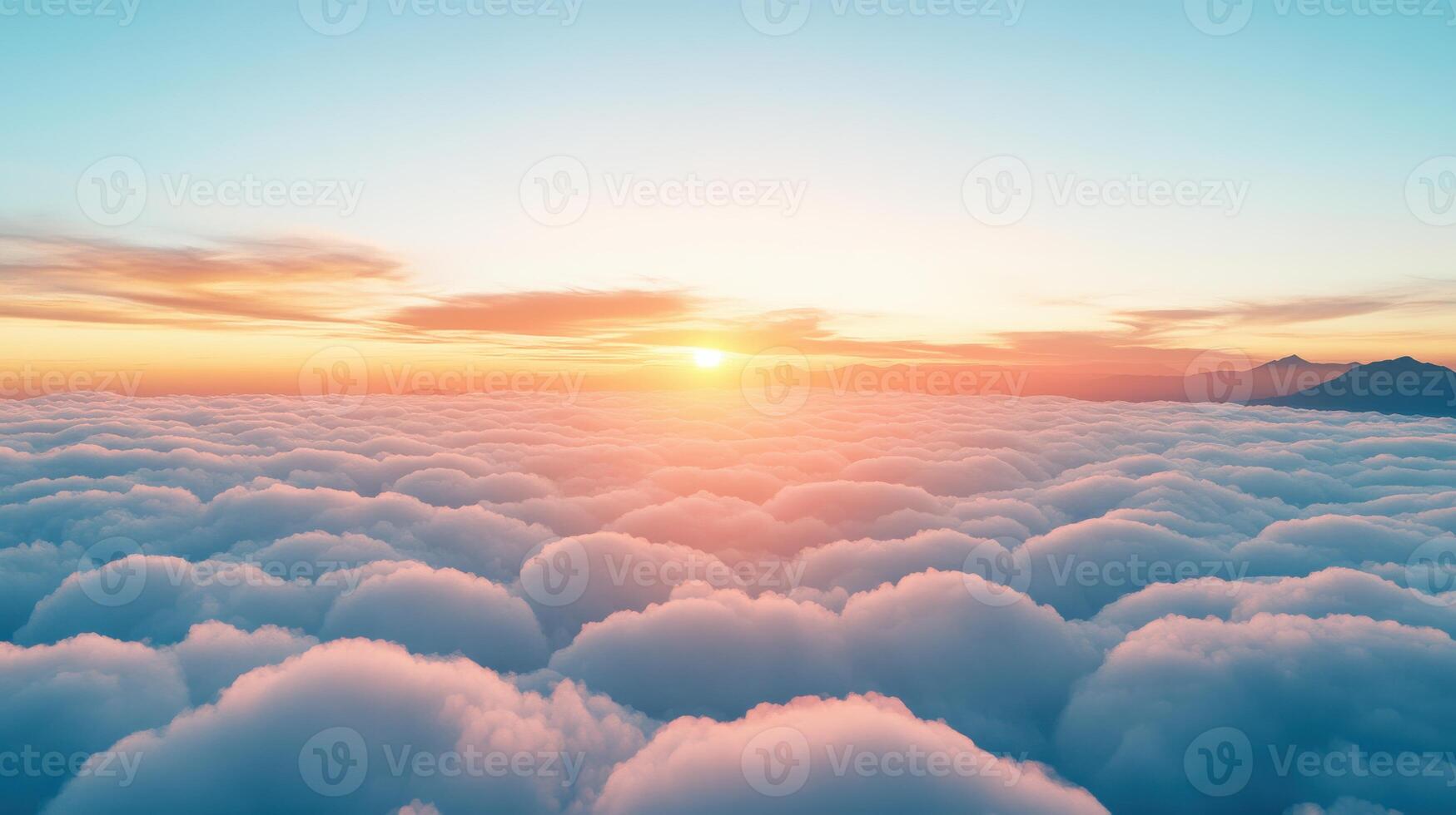 The sun is setting over the clouds in this photo