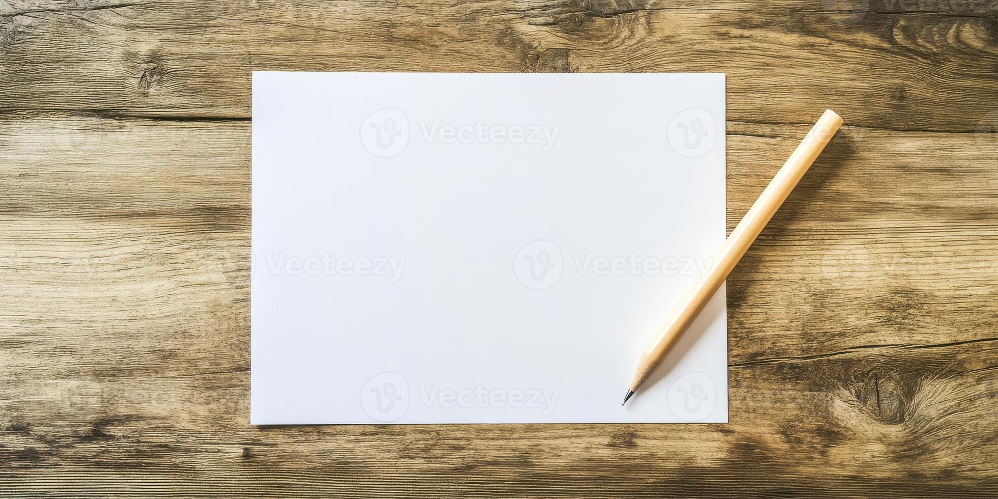 Blank paper and pencil on wooden table photo