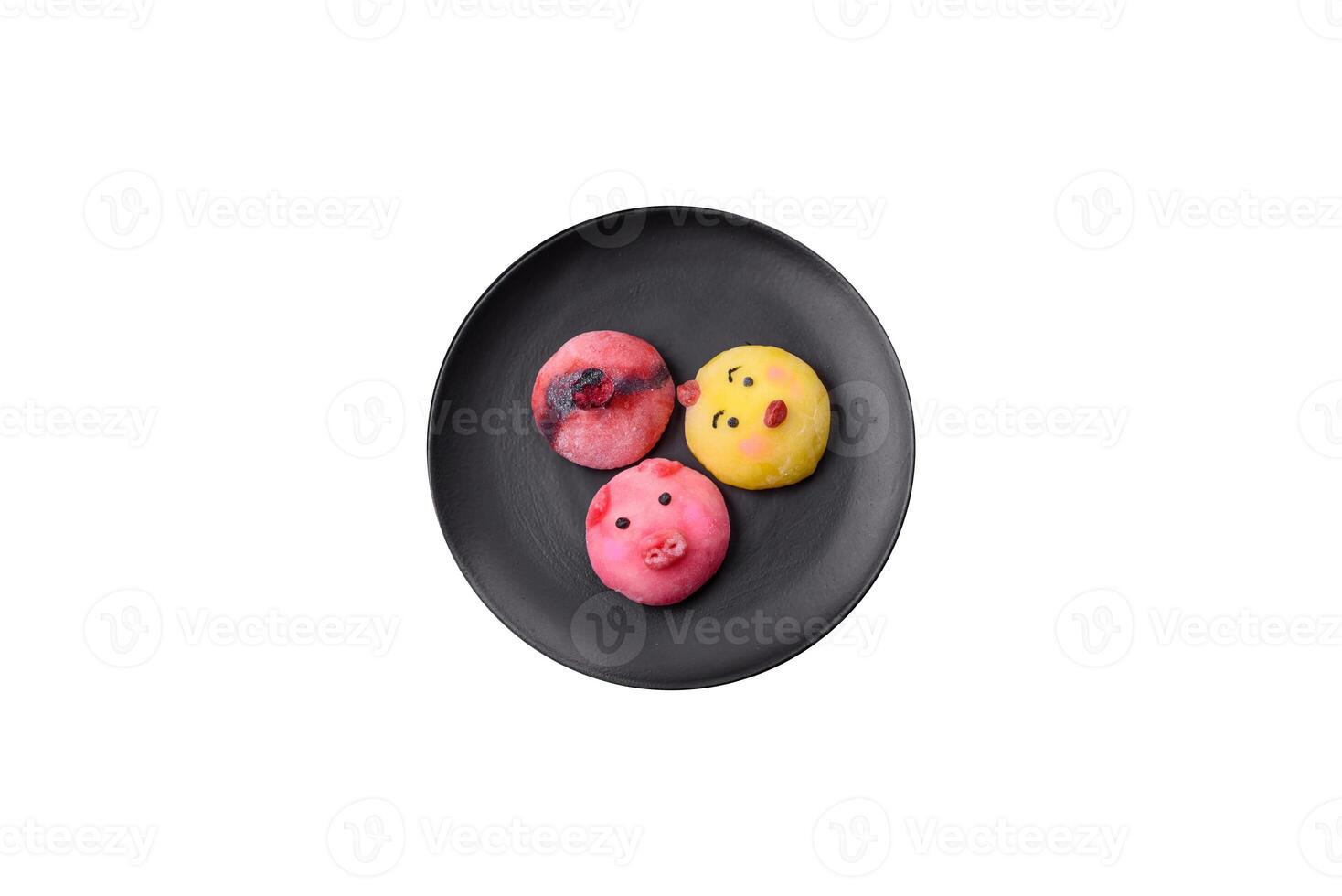 Delicious cold Japanese mochi dessert with colorful rice dough shell and fruit filling photo