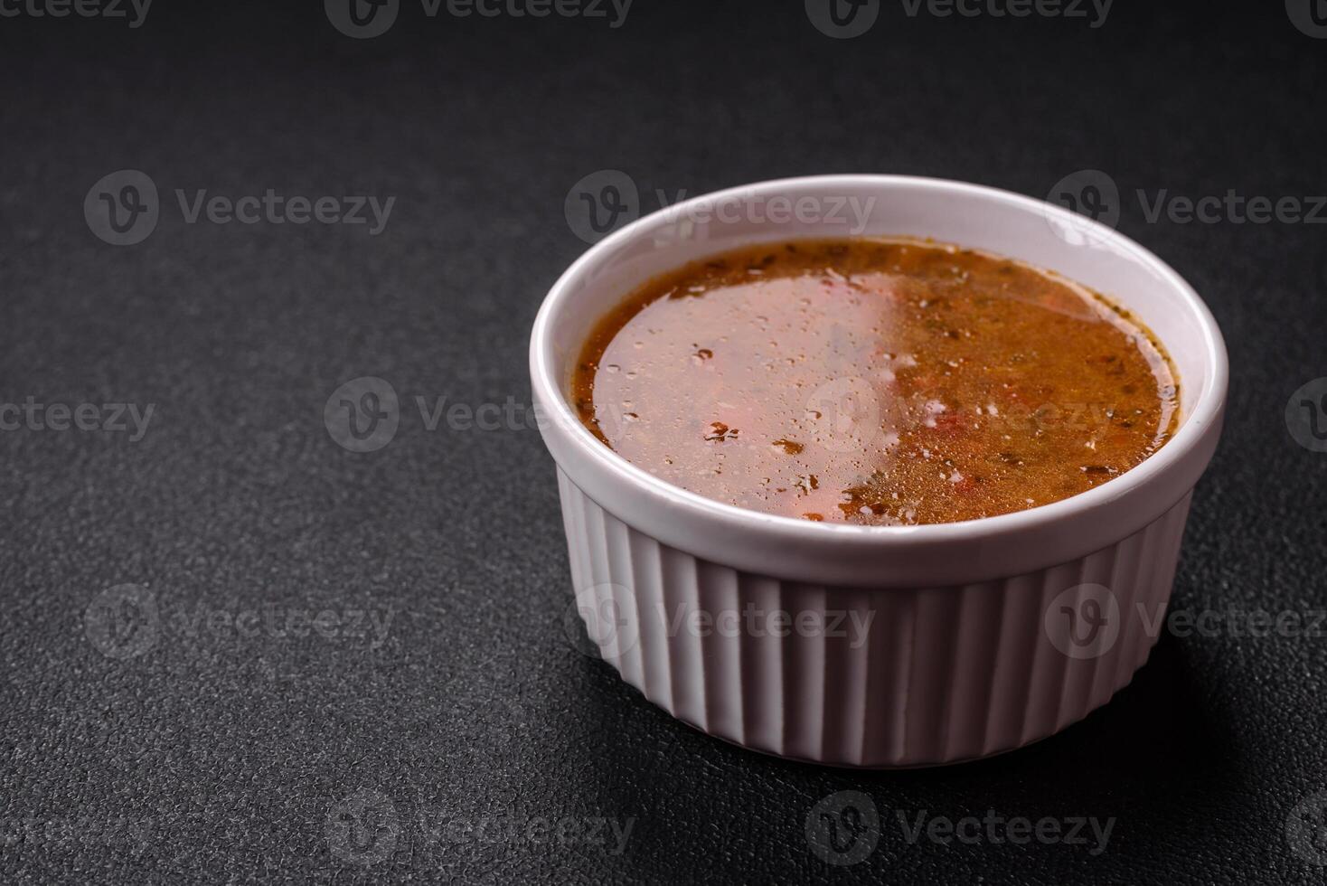 Delicious hot tomato soup with vegetables, vegan, vegetarian food photo
