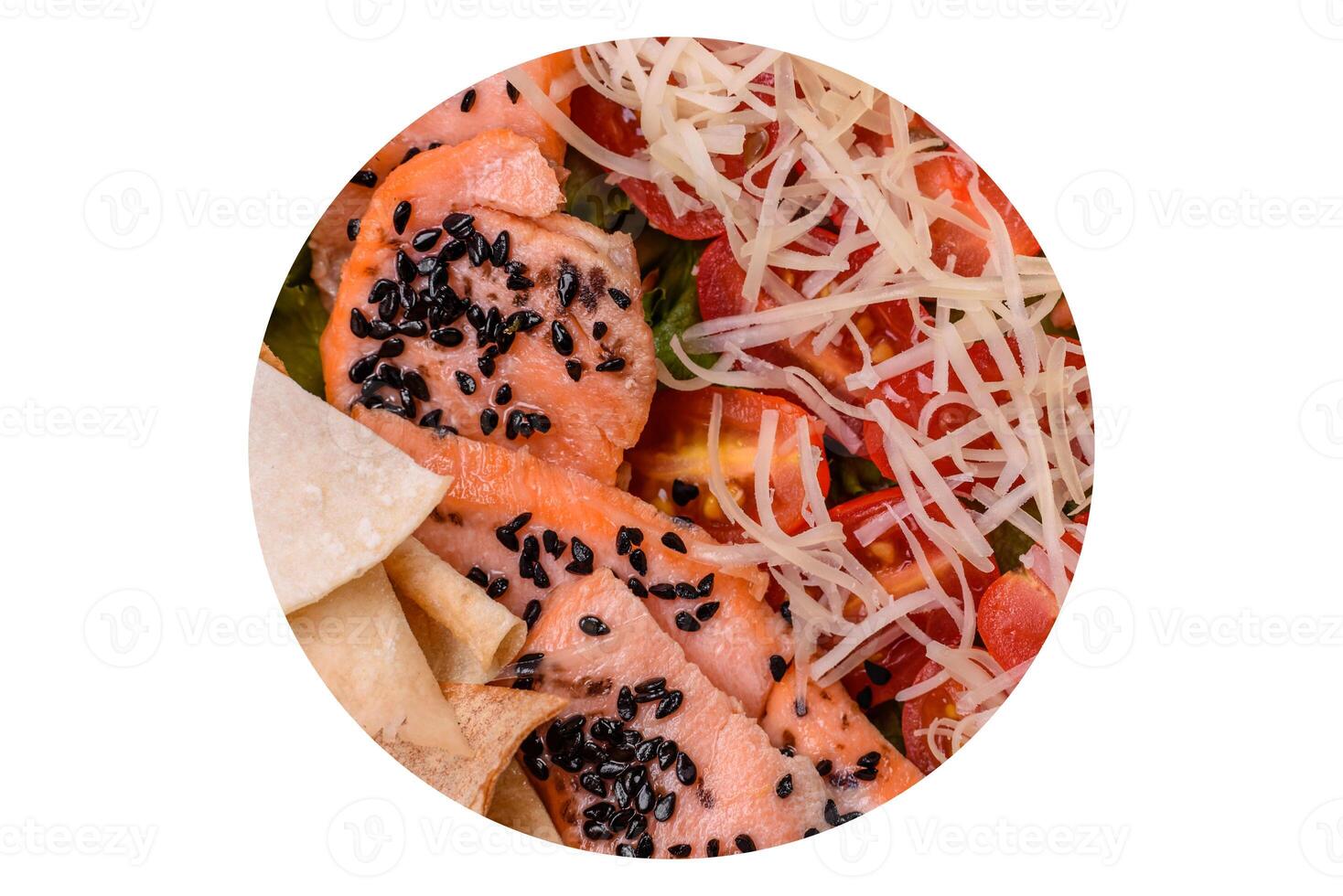 Delicious fresh caesar salad with salmon, lettuce, tomatoes and egg photo