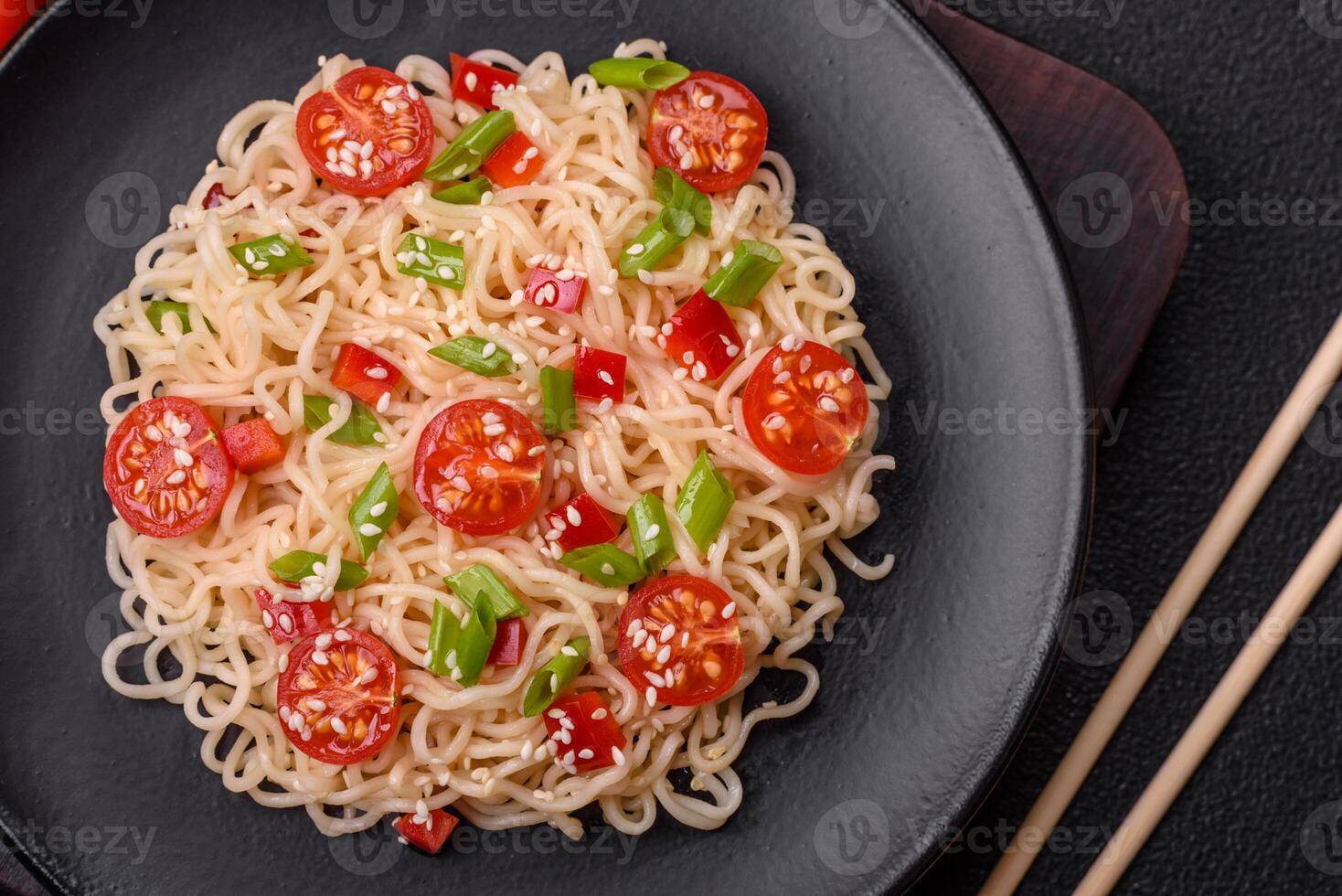 Rice noodles with mushrooms, vegetables, spices and herbs photo