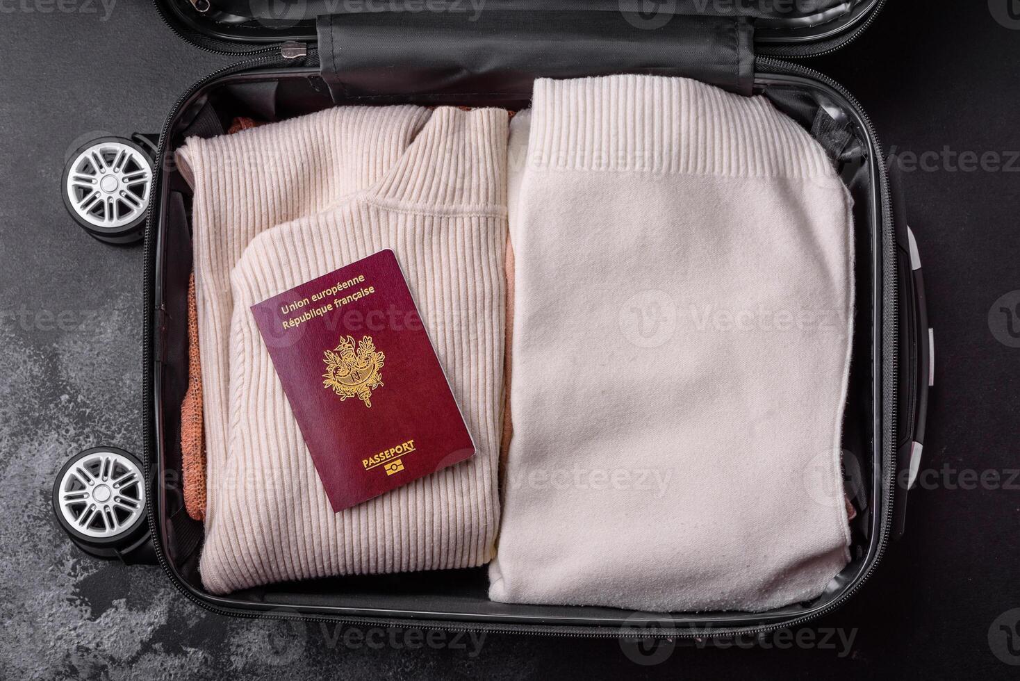 International passport of a French citizen on a suitcase photo