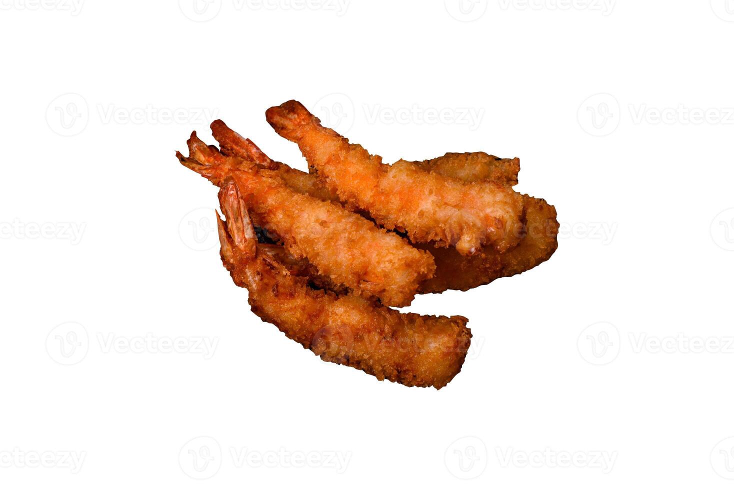 Hot crispy shrimp breaded with salt and spices with white sauce photo