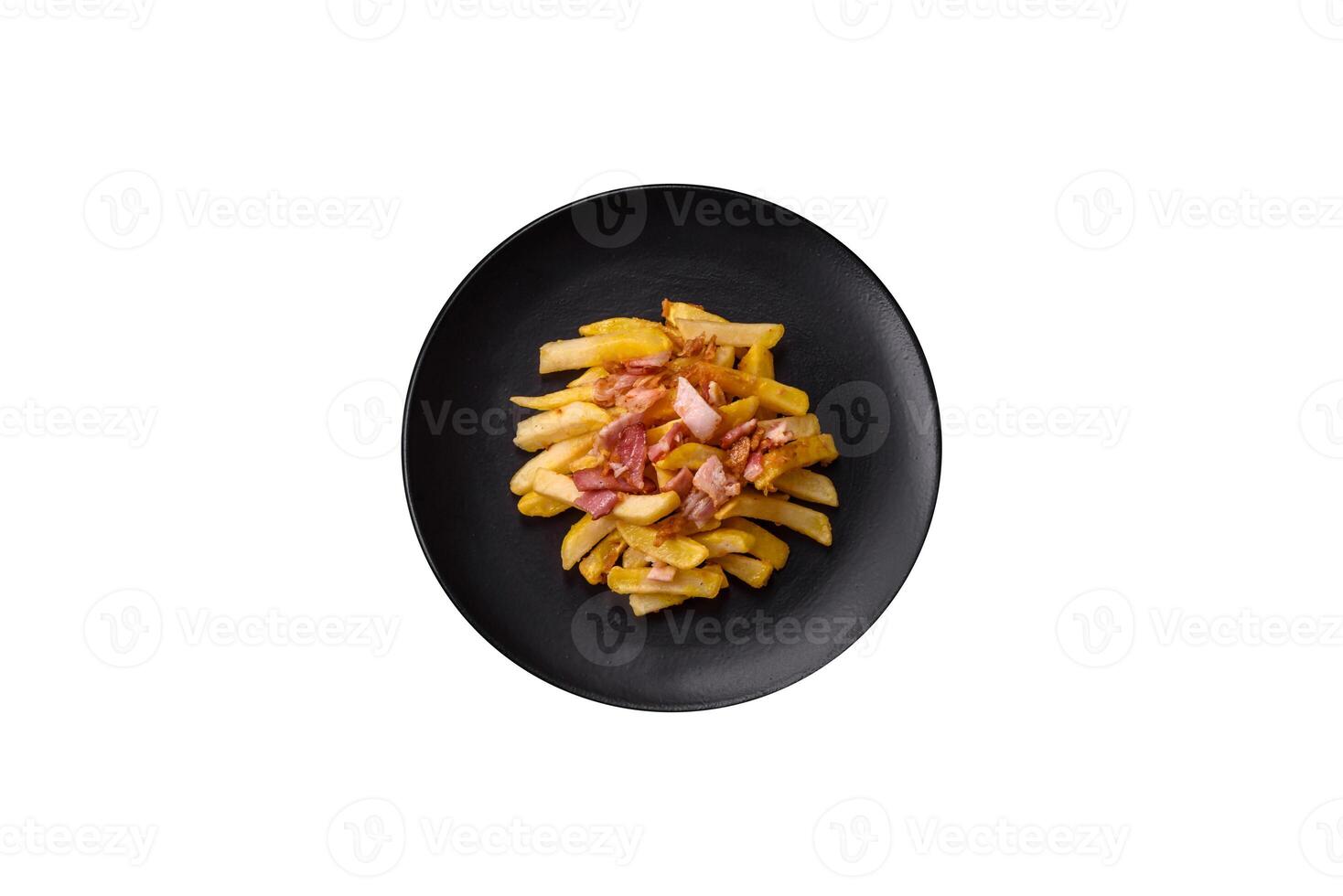 Crispy French fries with pieces of bacon, salt and spices photo