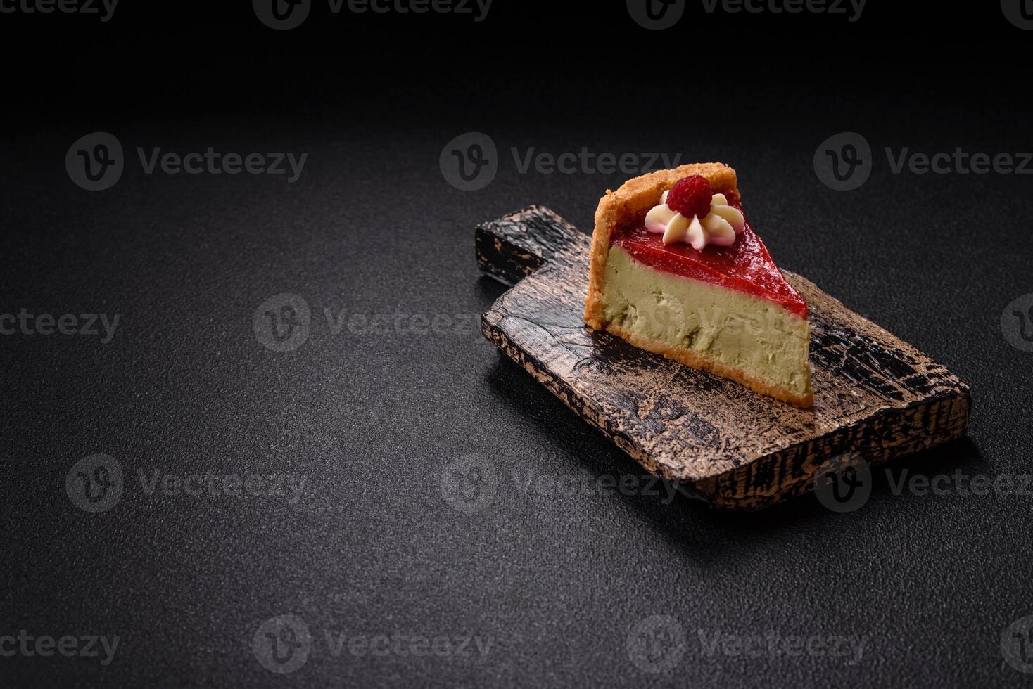Delicious sweet dessert cheesecake with raspberry and pistachio flavor photo