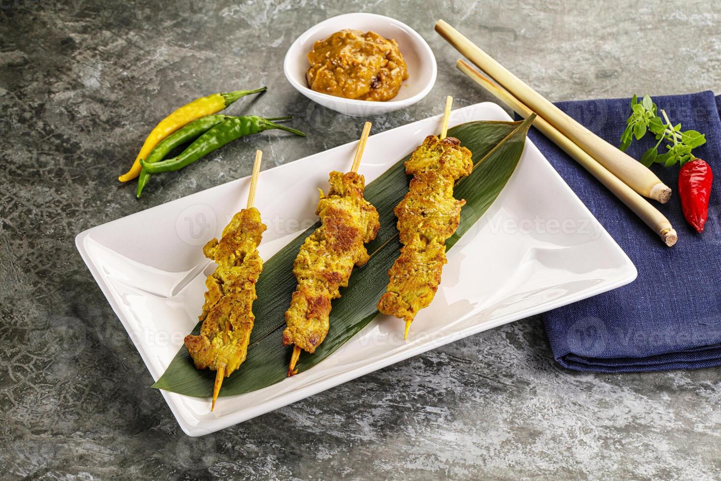 Thai meat skewer Satay with sauce photo