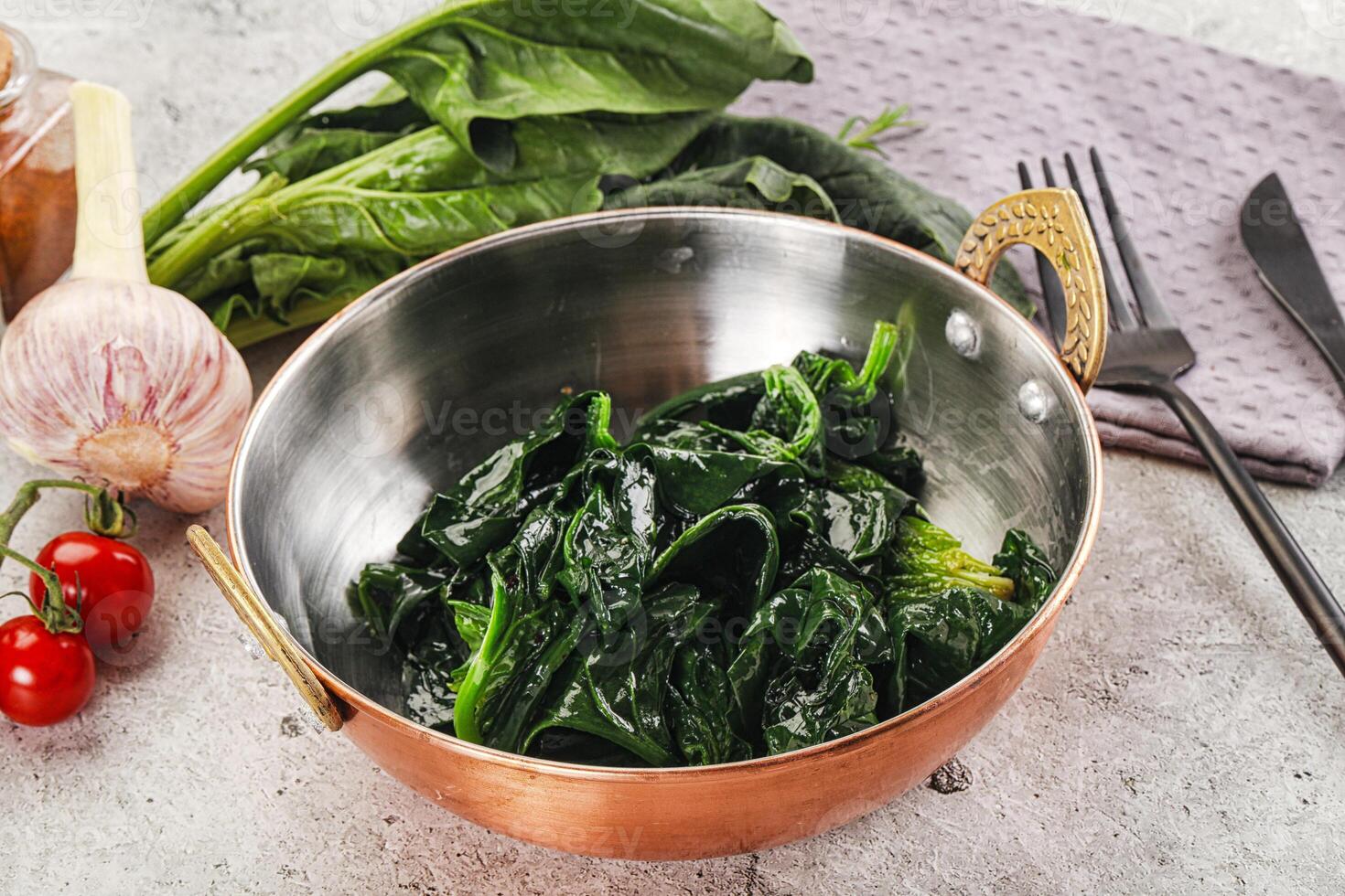 Coocked green spinach with oil photo