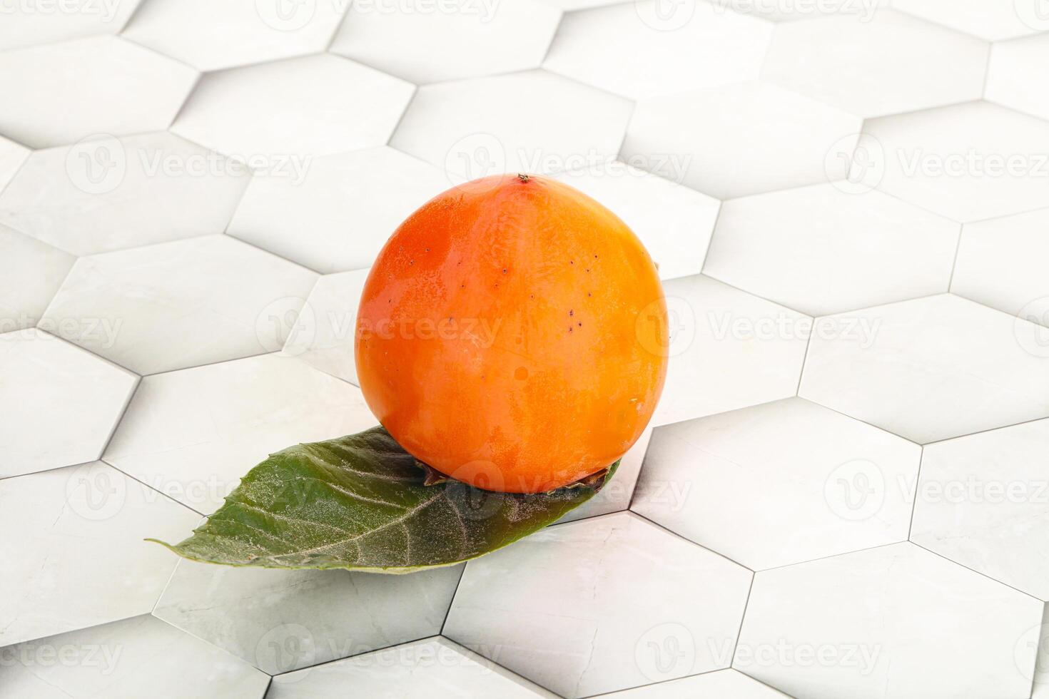 Fresh ripe sweet juicy persimmon photo