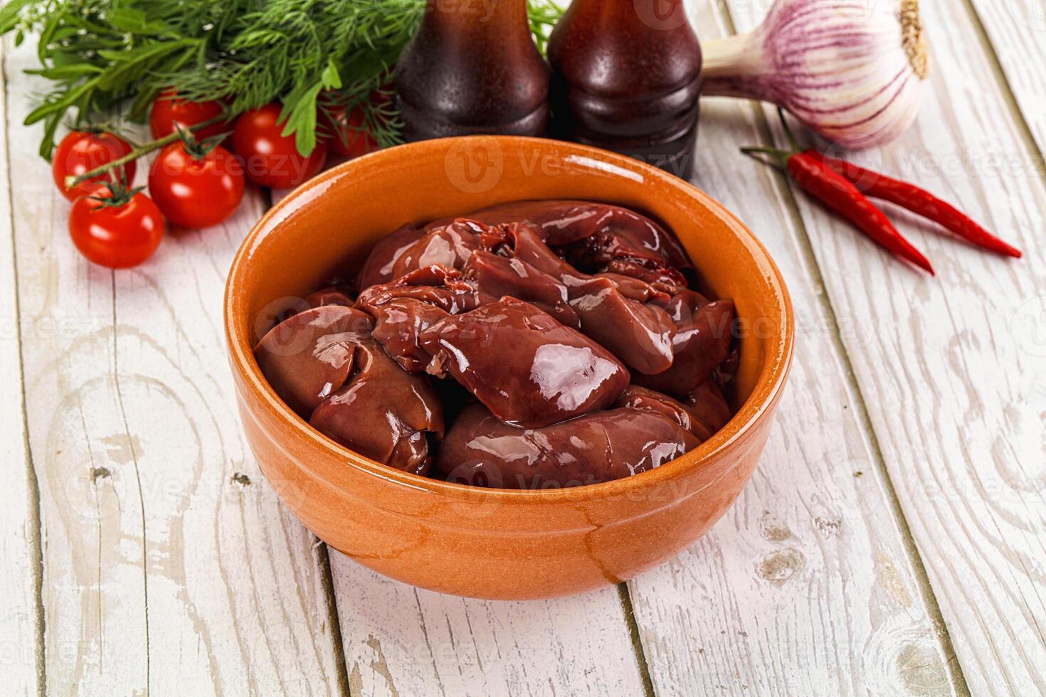 Raw chicken liver uncooked in the bowl photo