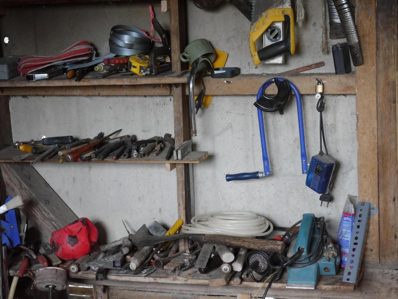a collection of carpenter's tools in a village house photo