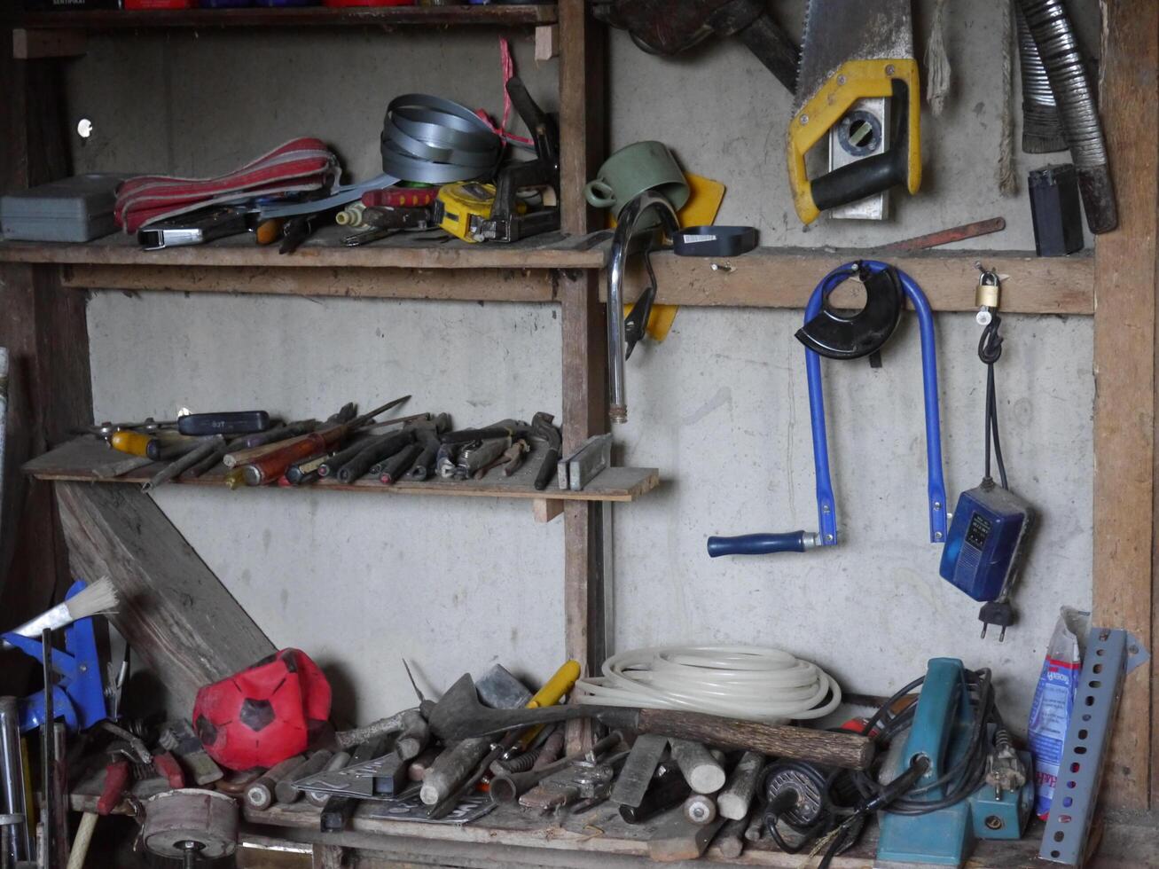 a collection of carpenter's tools in a village house photo