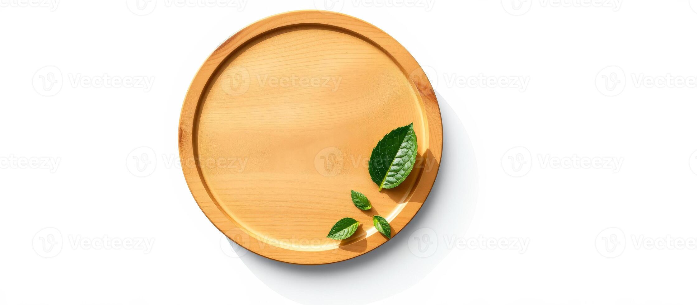 Wooden Plate with Green Leaves photo