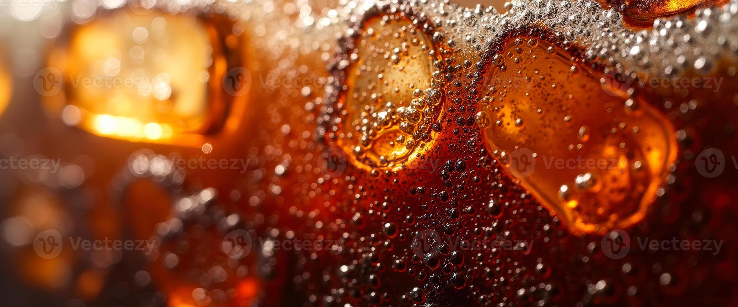 Close-up of Fizzy Brown Liquid with Ice photo