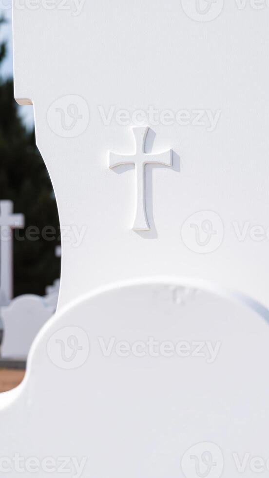 White Cross on a White Headstone photo