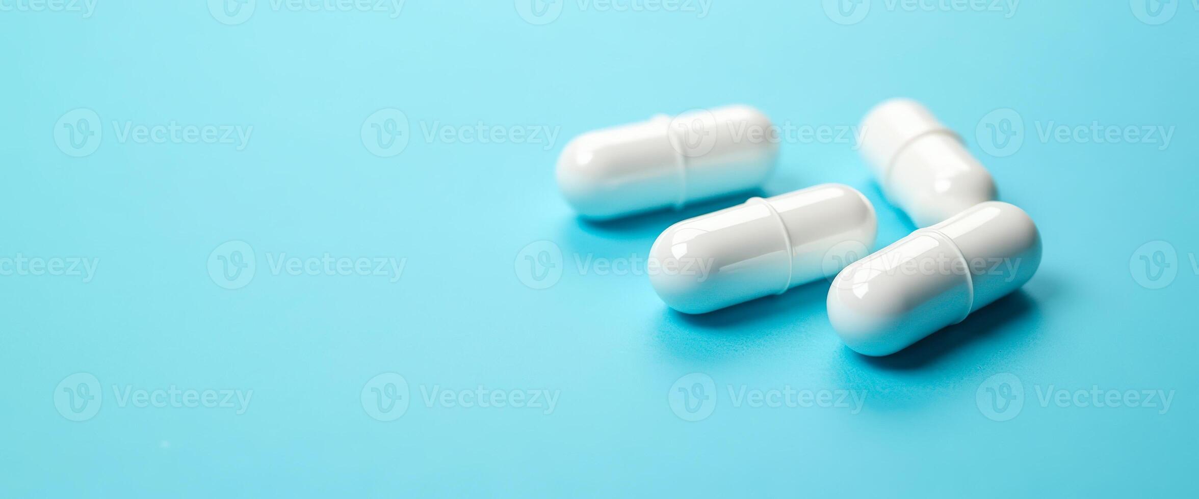 White Pills on Blue Background photo