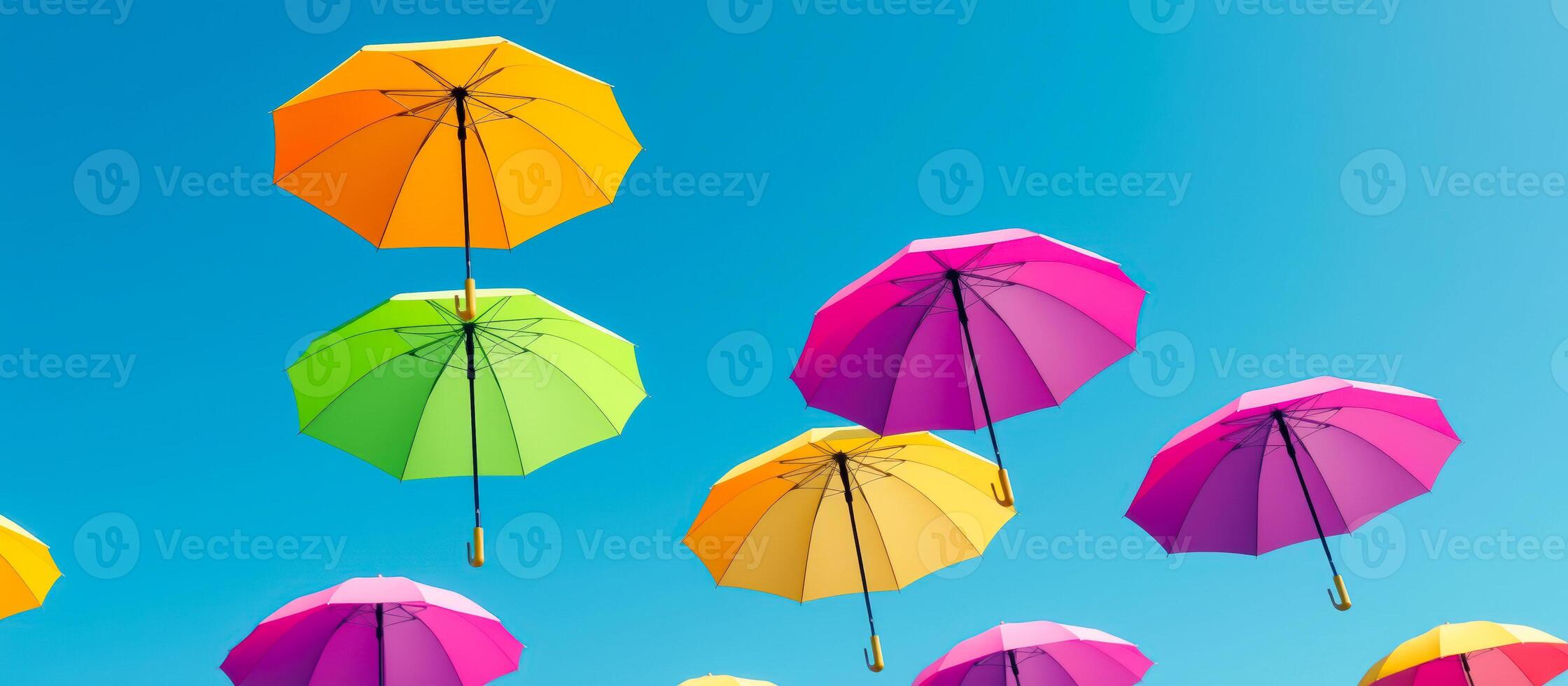 Colorful Umbrellas Against Blue Sky photo