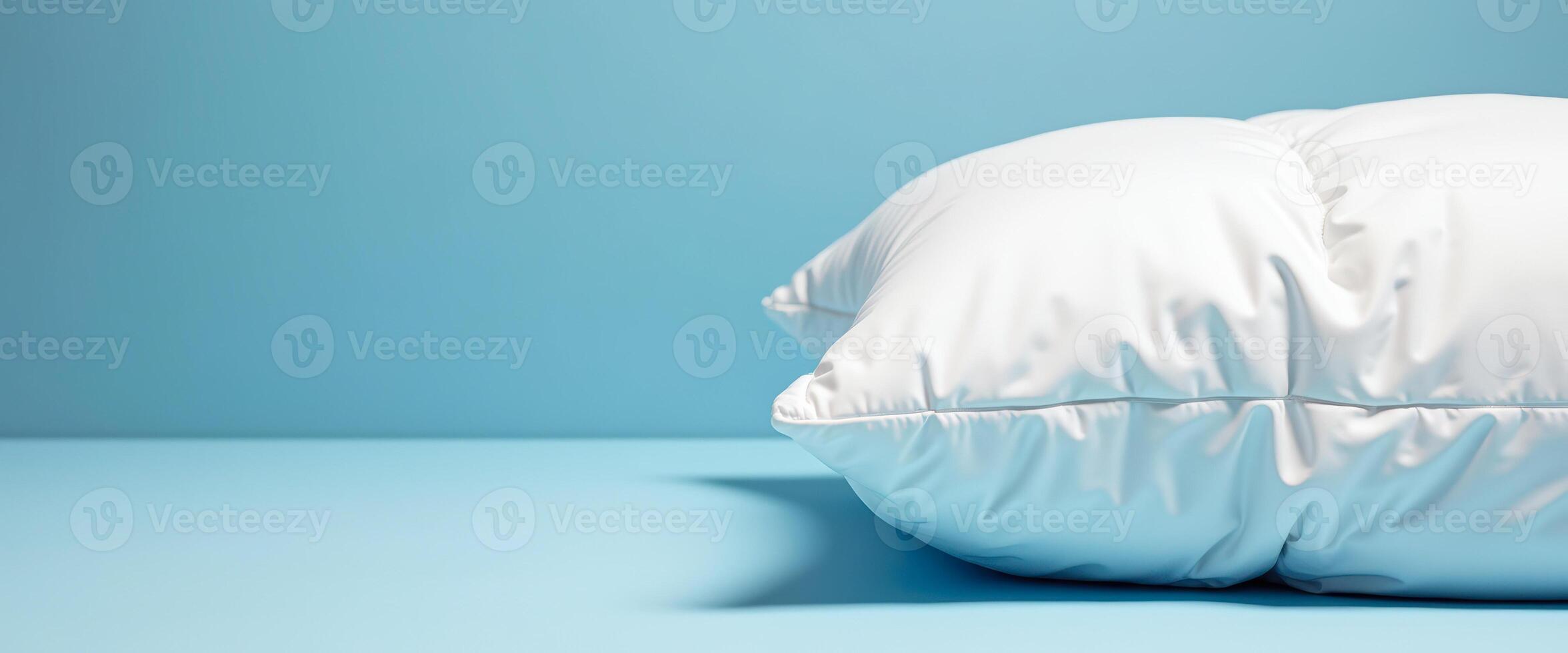 White Pillow on Blue Background photo