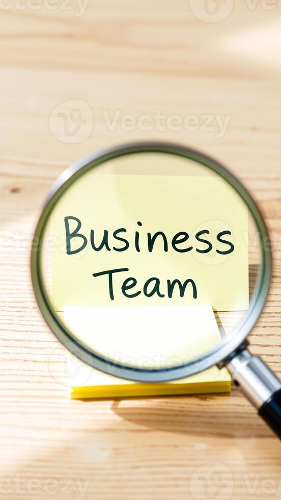 Business Team Under the Magnifying Glass photo