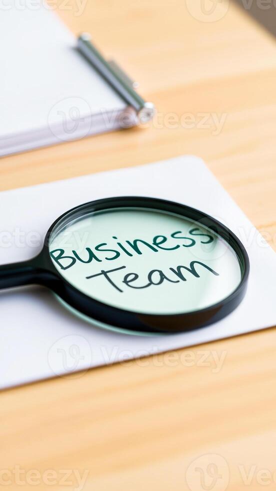Magnifying Glass Focusing on Business Team photo