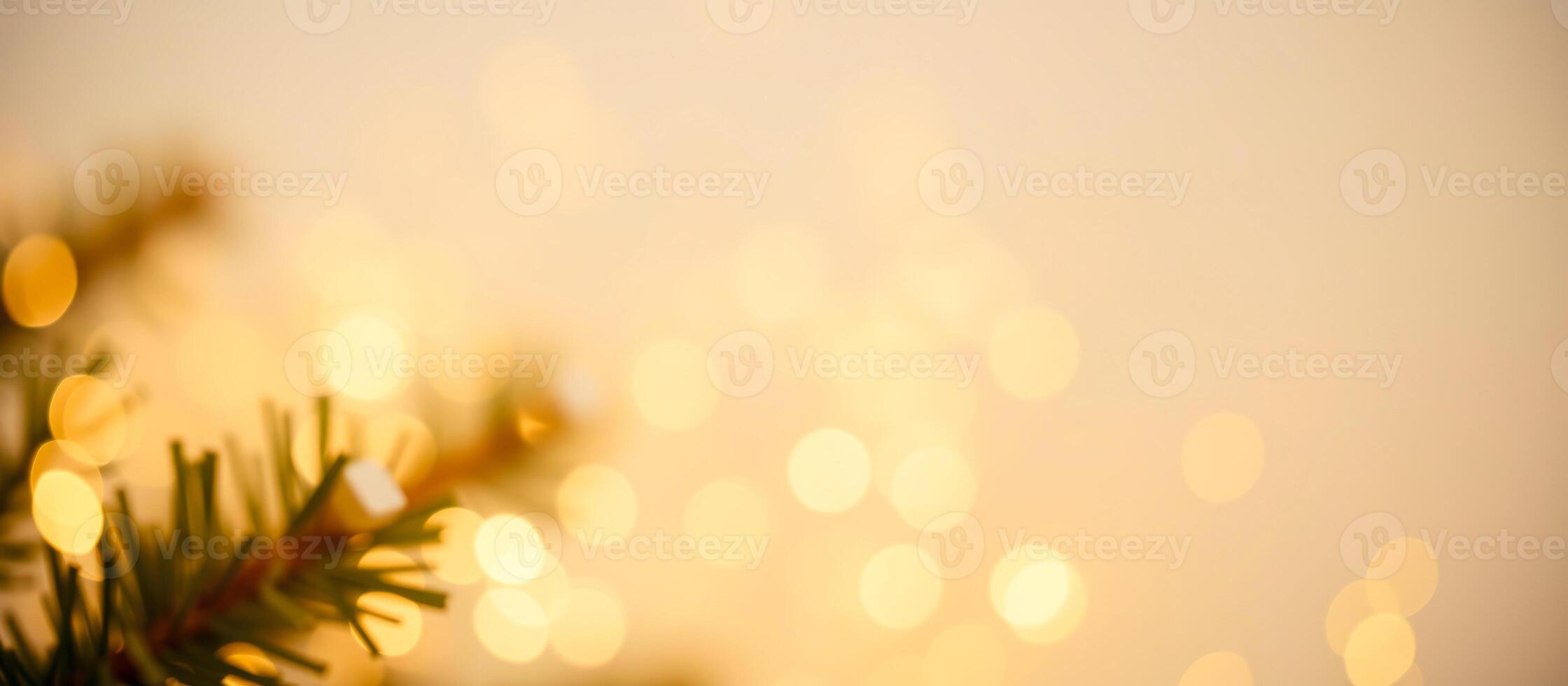 Festive Background with Warm Golden Bokeh and Christmas Tree Branch photo