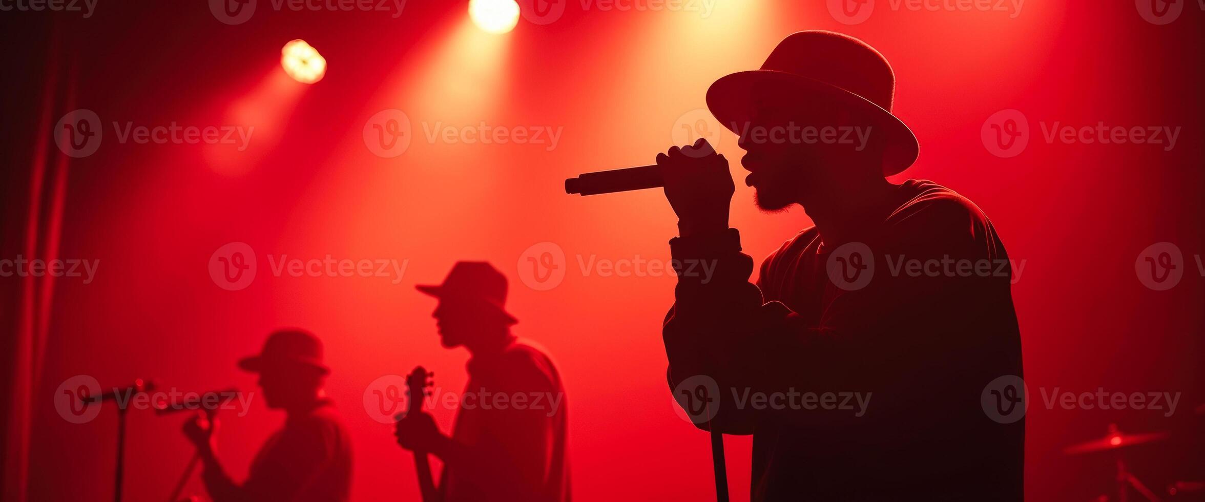 Silhouetted Singer in Red Spotlight photo