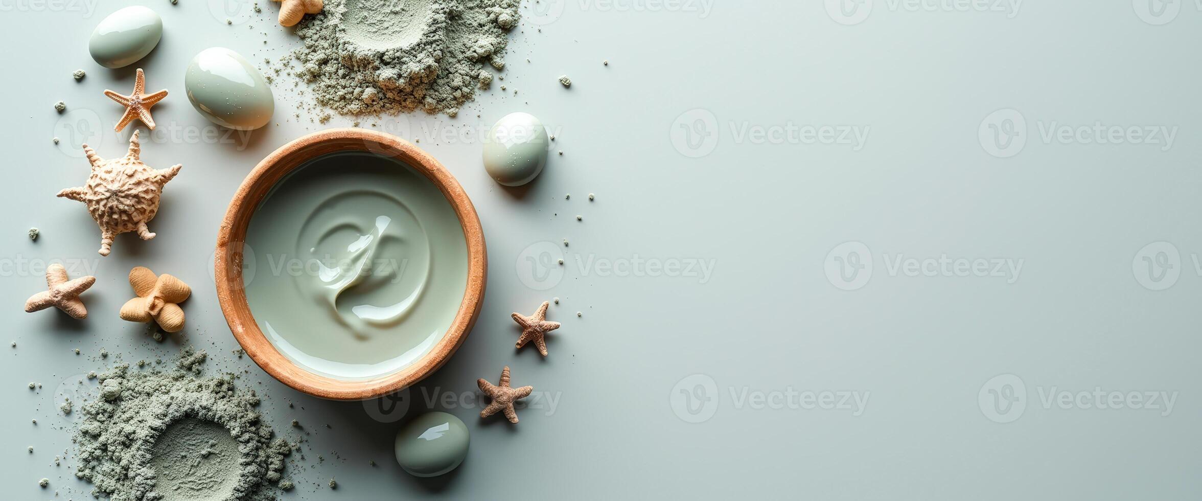 Green Clay Face Mask with Sea Shells and Starfish on a Light Background photo