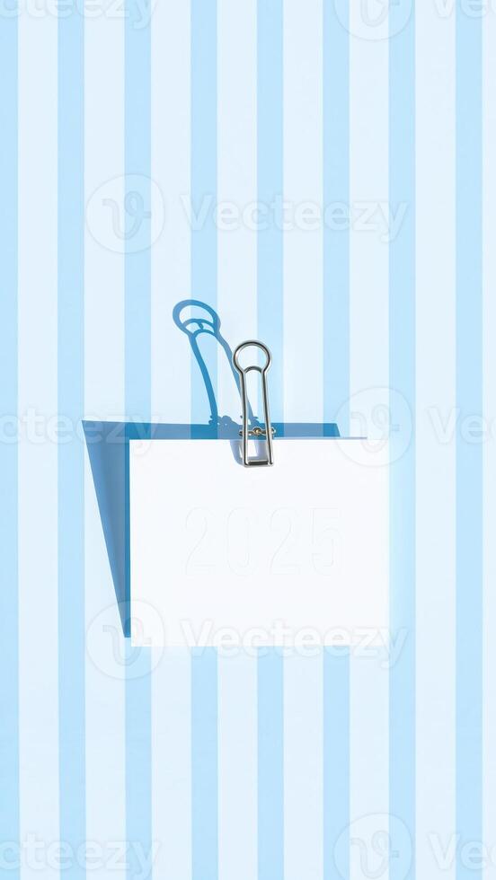 Minimalist New Year's 2025 Card with Paper Clip and Blue Stripes photo