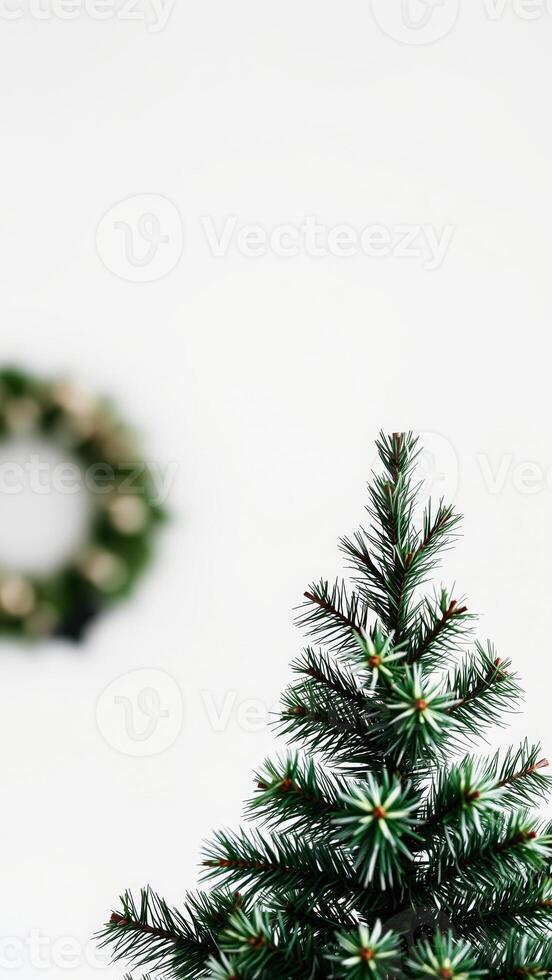 Minimal Christmas Tree with Blurred Wreath in Background photo
