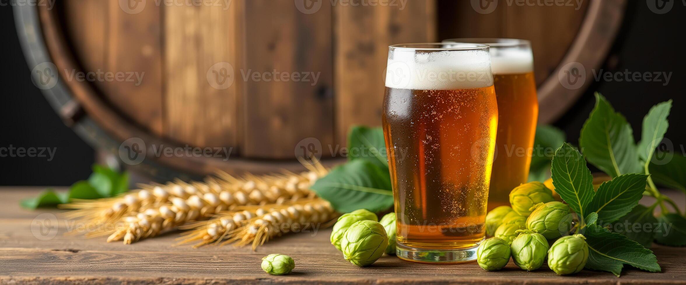 Two Glasses of Beer with Wheat and Hops on Wooden Table photo