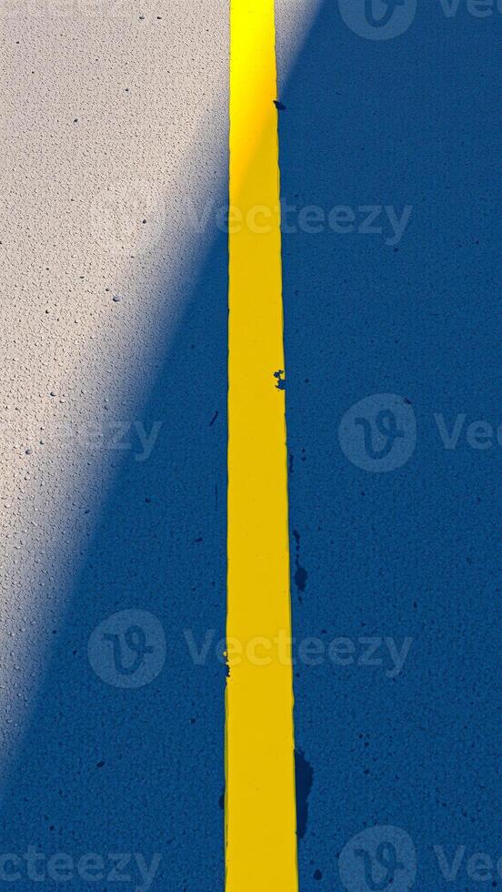 Yellow Line on Blue Asphalt Road photo