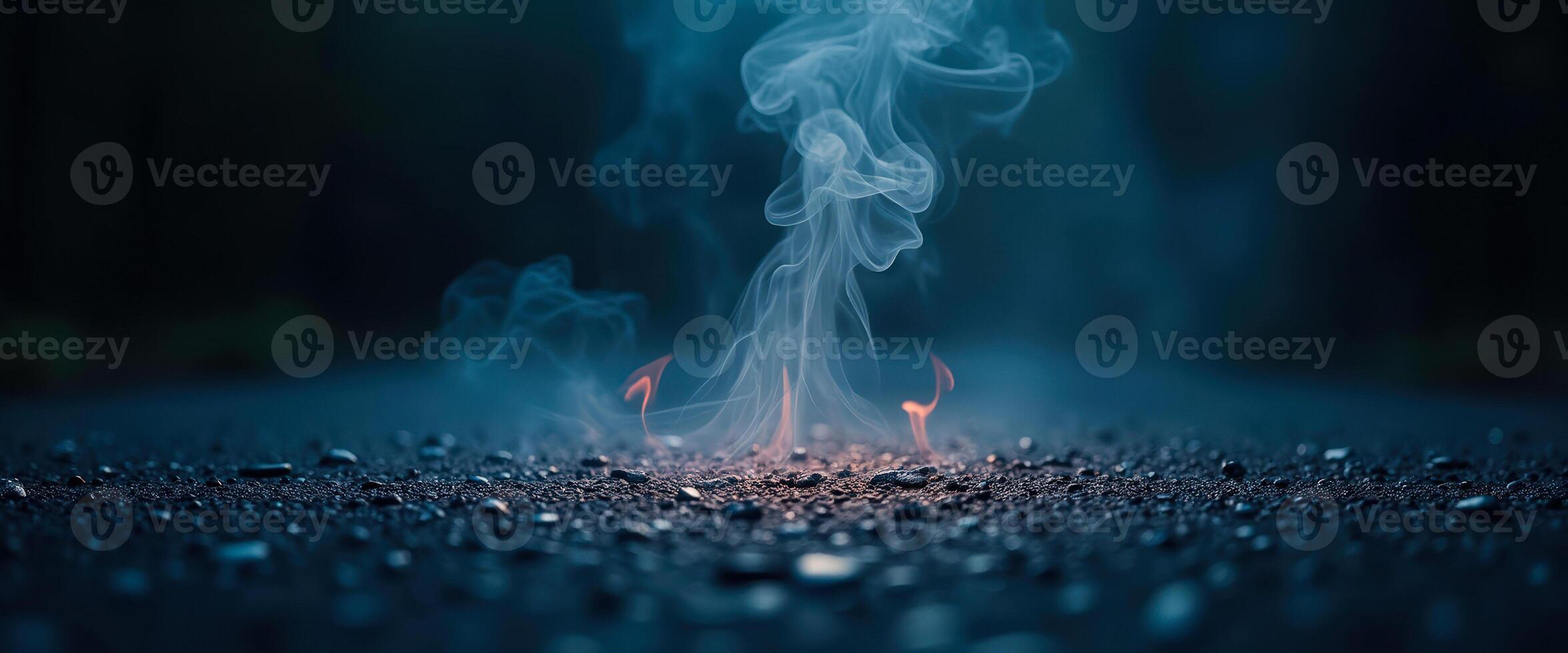 Smoke and Fire on a Dark Surface photo