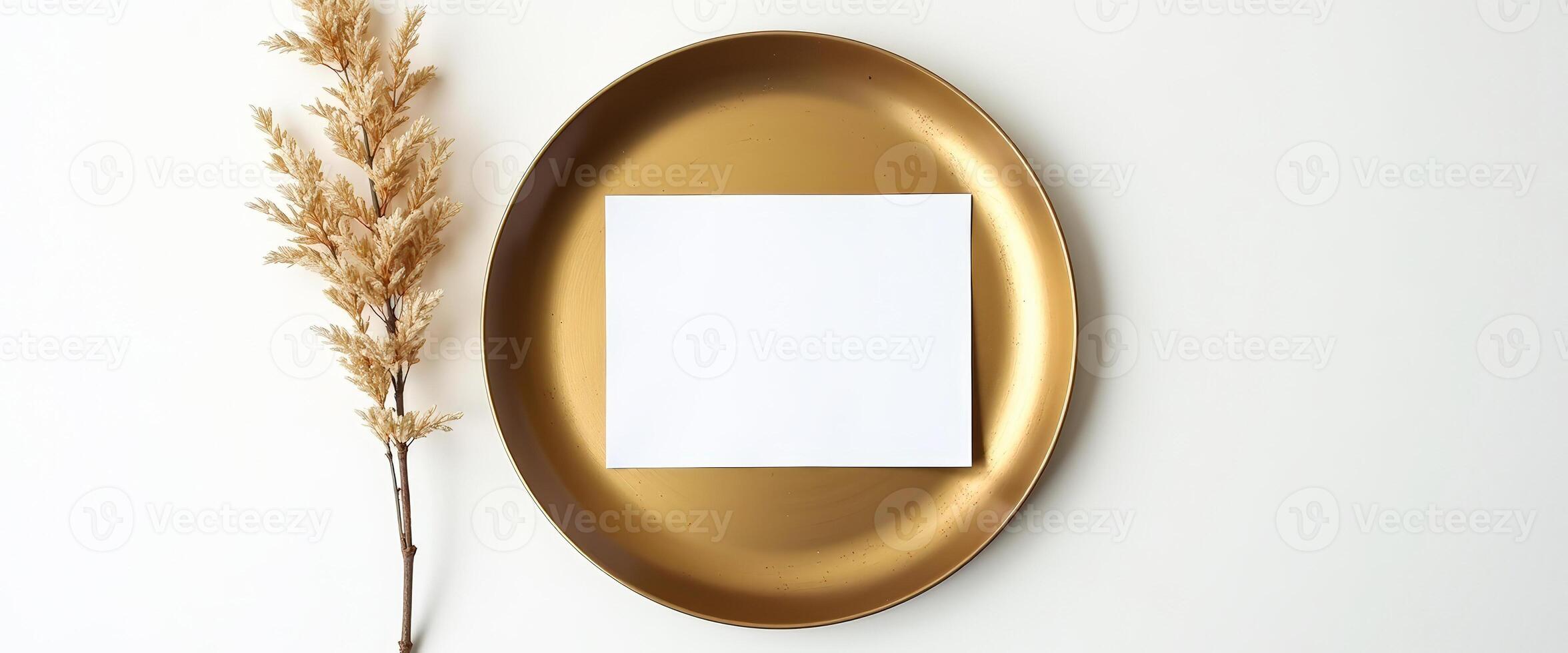 Blank Card Mockup on Gold Plate with Dried Grass photo
