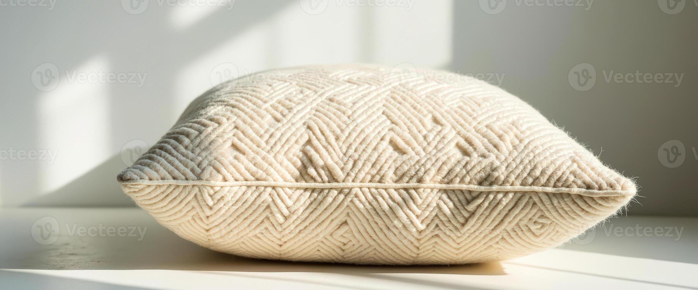 Close-up of a Soft White Pillow with a Geometric Pattern photo