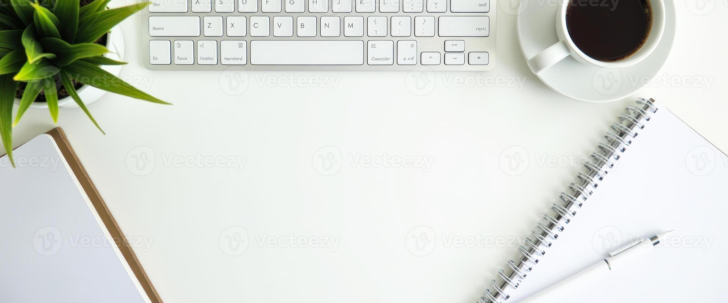 Minimalist Workspace with Coffee, Keyboard, and Notebook photo