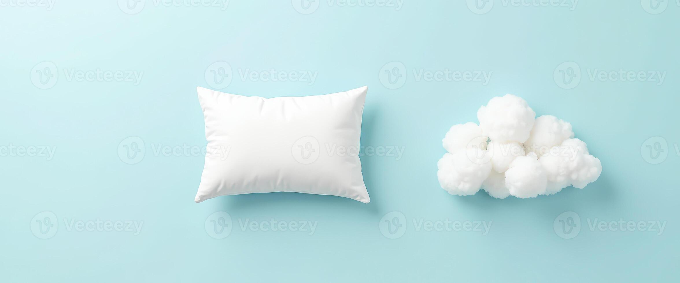 White Pillow and Cotton Balls on Blue Background photo