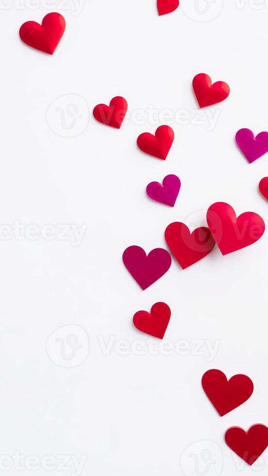Red and Pink Hearts Scattered on White Background photo
