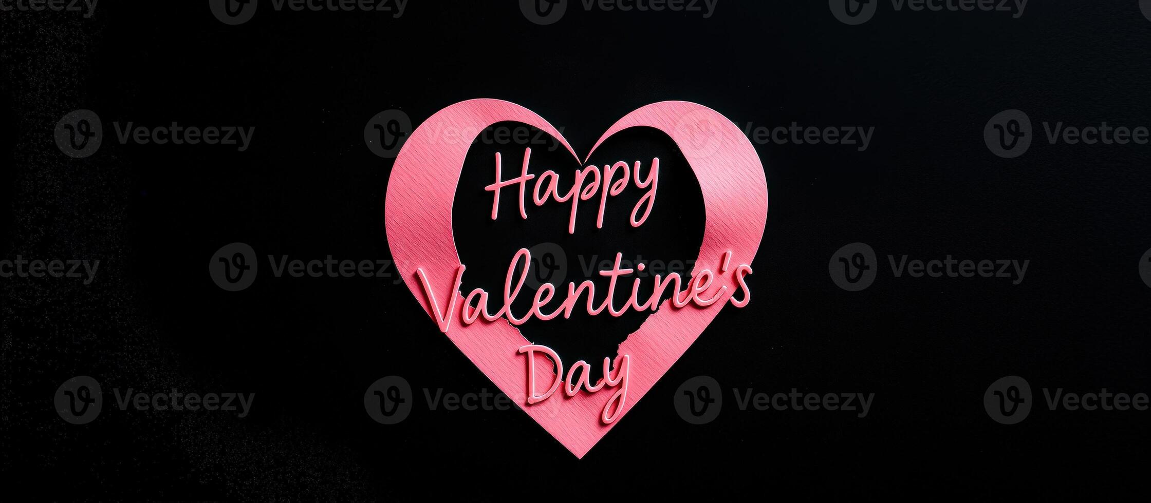 Pink heart with Happy Valentine's Day cutout on black background photo