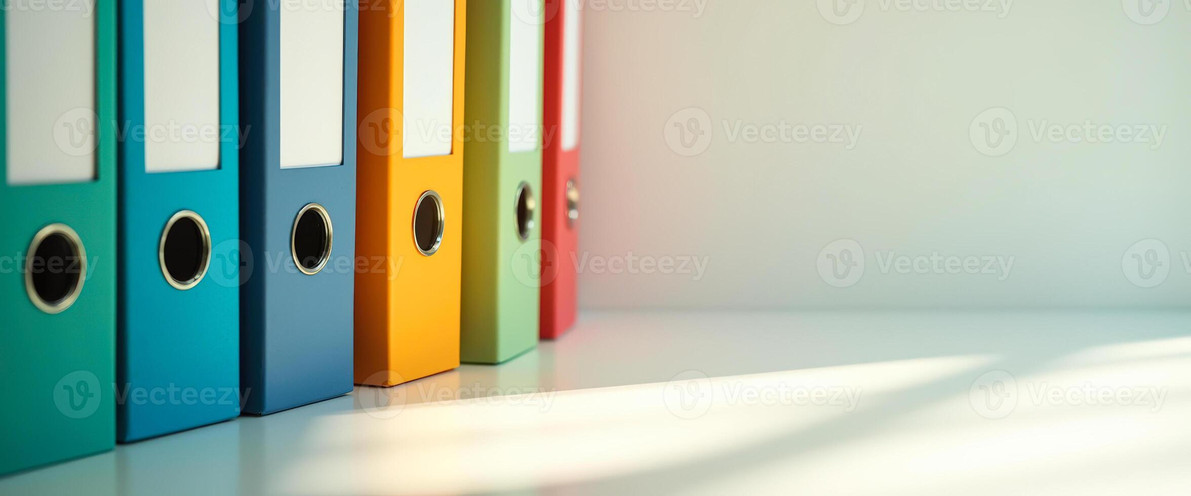 Colorful Binders on a White Surface photo