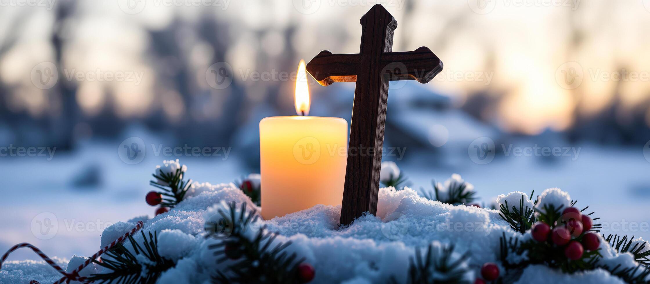 Lit Candle and Cross in Snow with Sunset Background photo